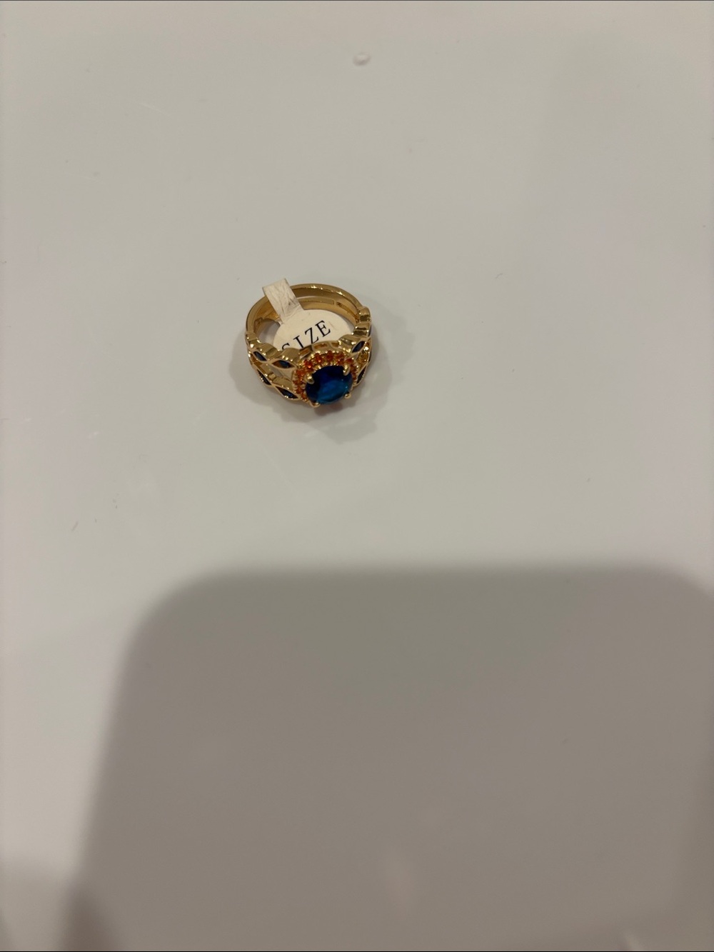 Othr Gold Ring with Deep Blue Center Stone